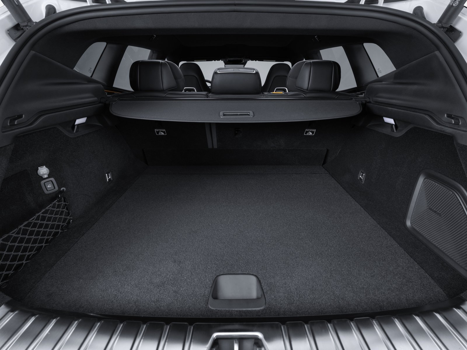 Polestar 4 SUV cargo area with rear seats upright and cargo cover