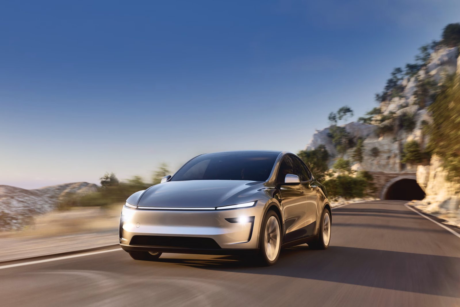 Tesla Model Y driving on a mountain road