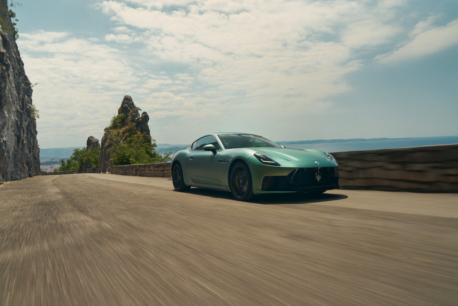 Maserati GranTurismo Trofeo driving on a coastal road