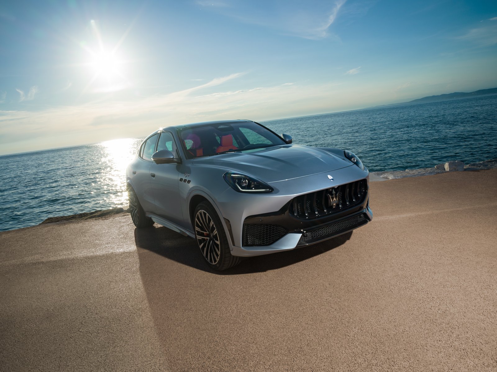 Maserati Grecale SUV parked by the sea at sunset