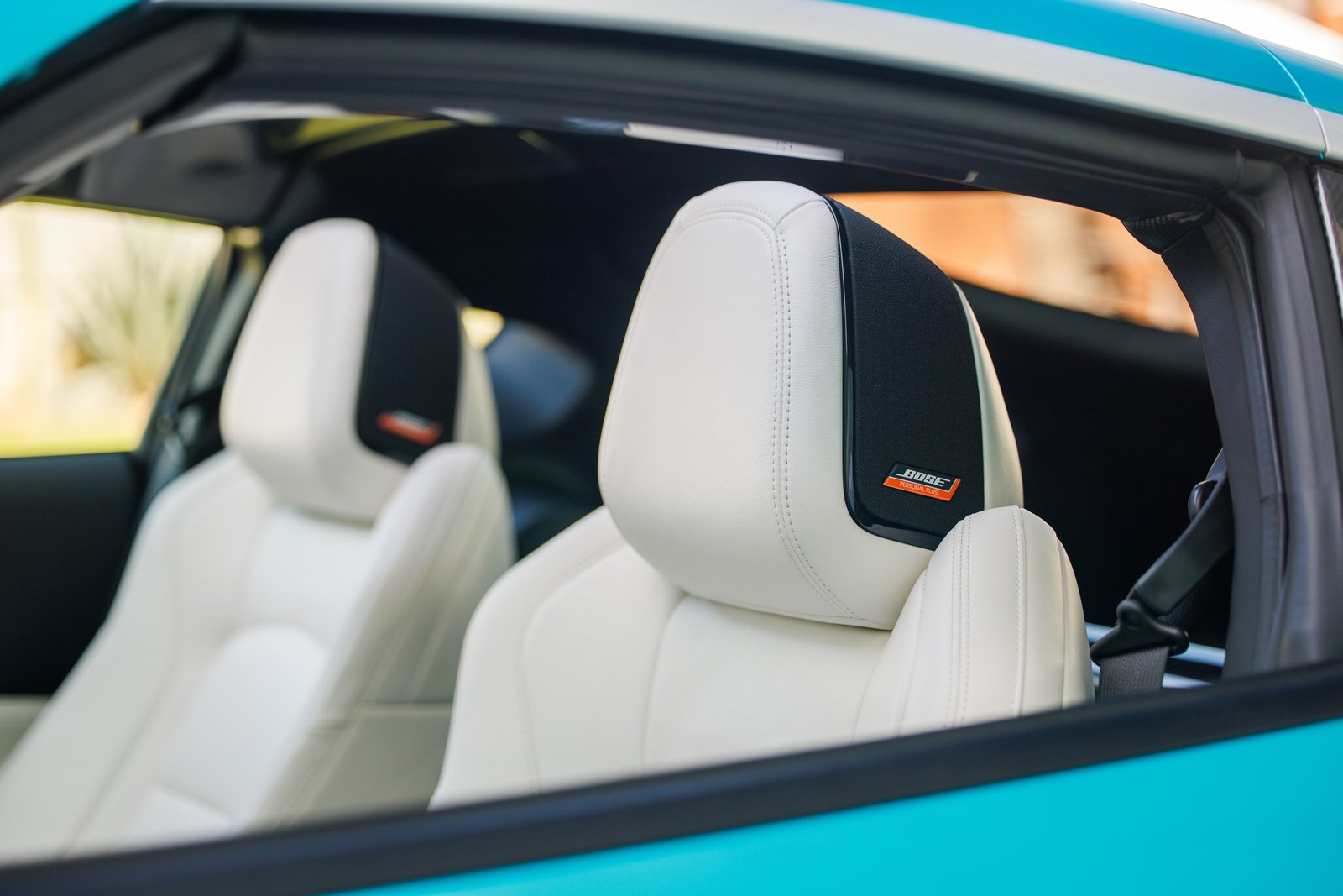 White leather seats with Bose Personal Plus headrest speakers in the Z Kaze