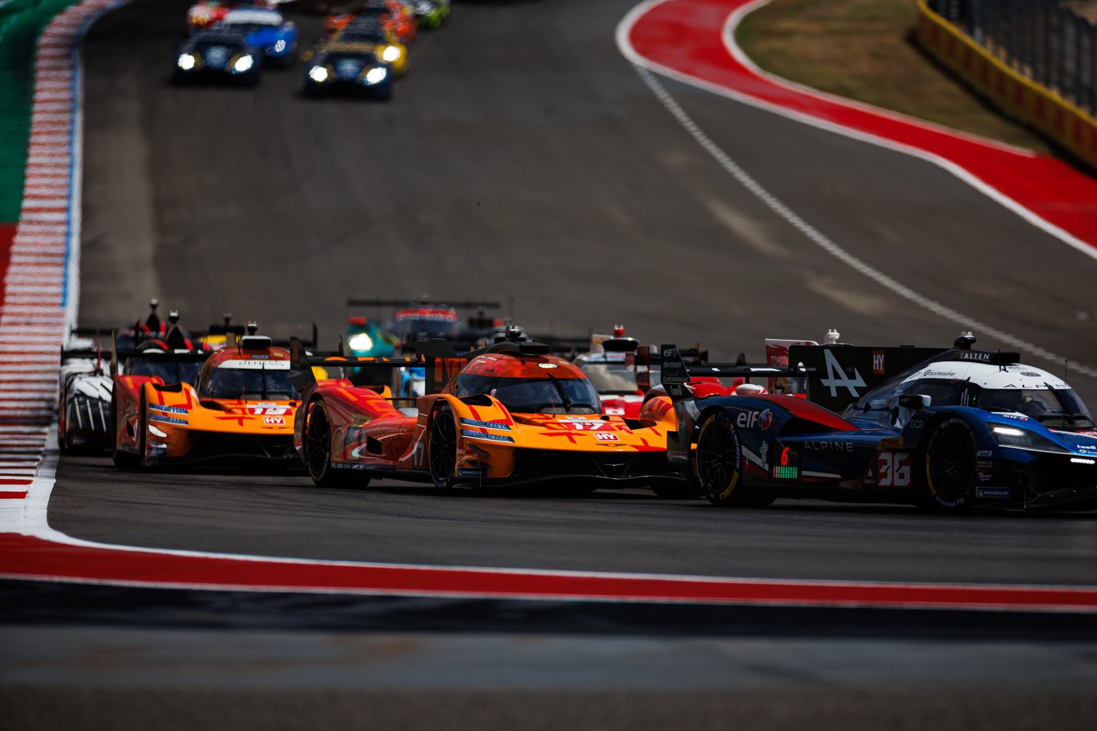 Genesis #17 battles Alpine #36 at the start at COTA