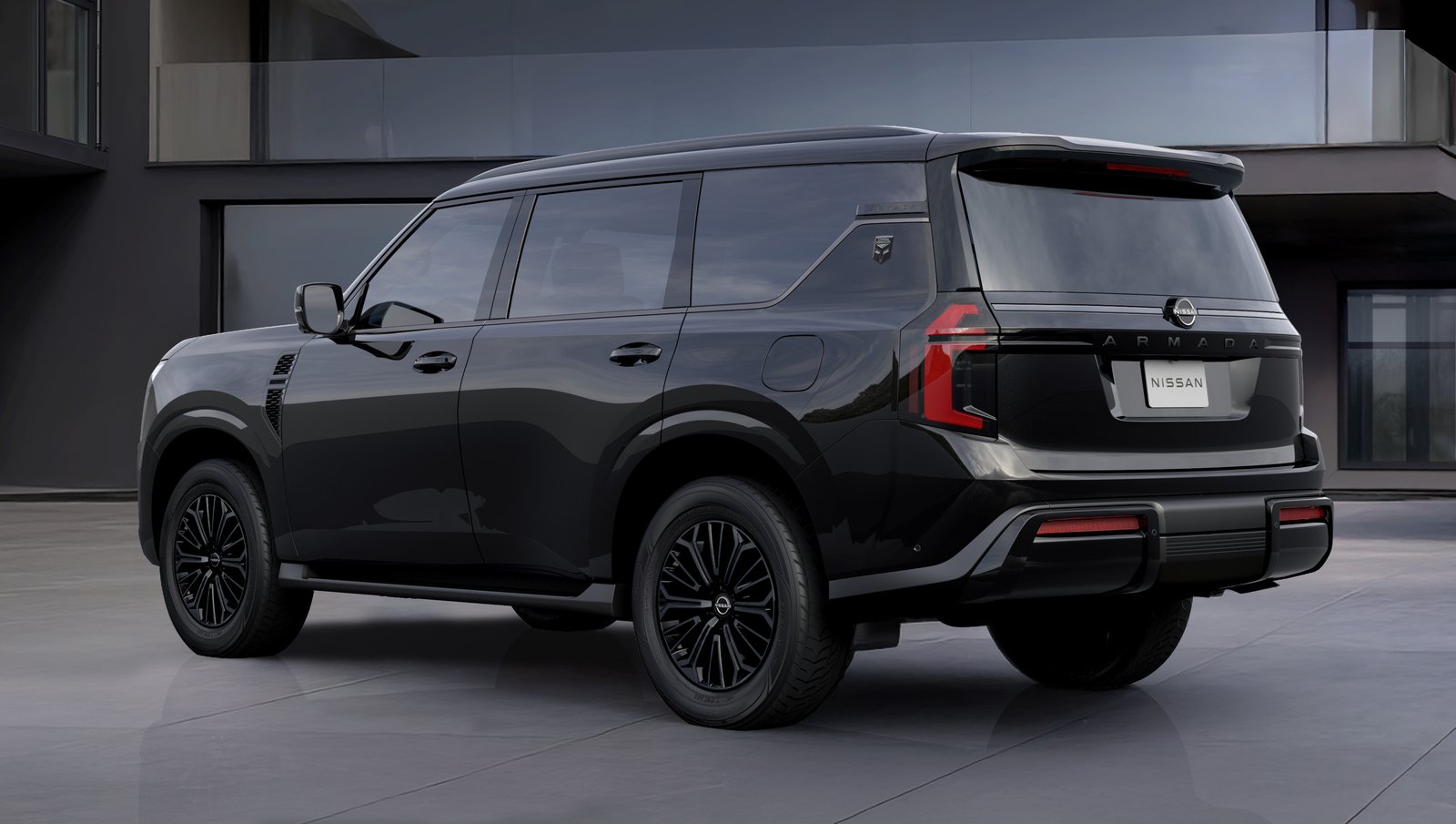 2027 Nissan Armada Dark Armor rear three-quarter view with black badges