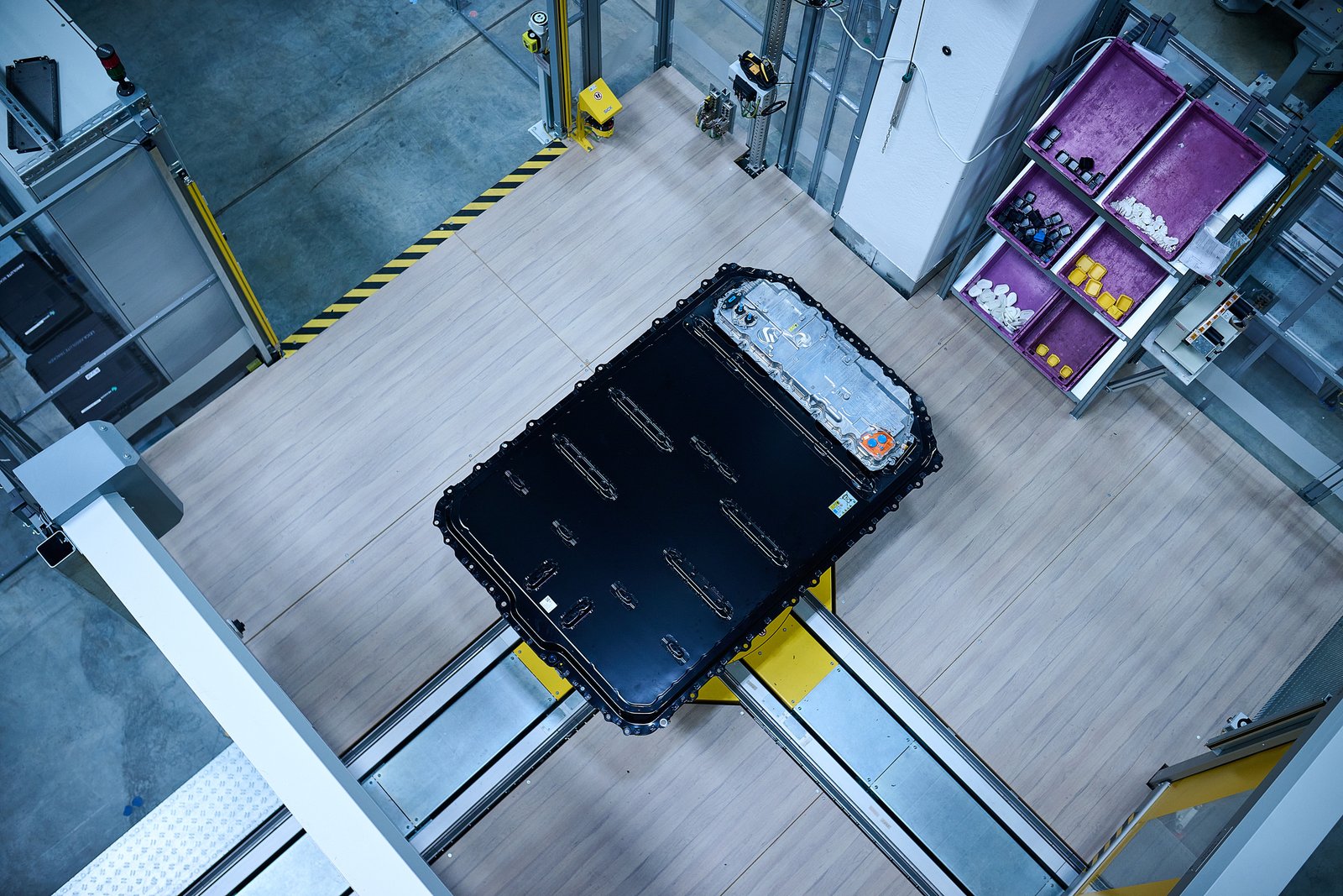 Overhead view of BMW Gen6 battery pack on assembly station