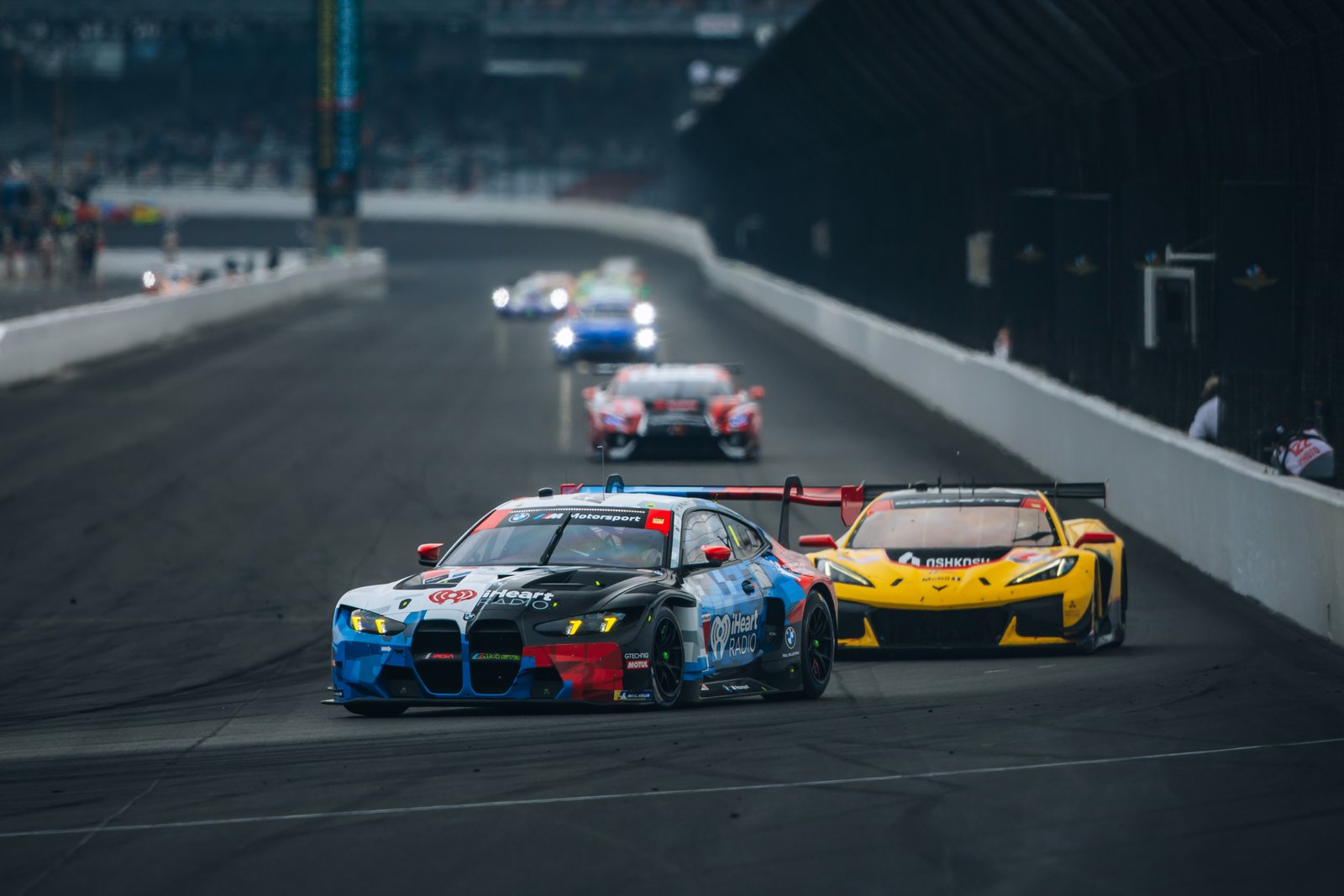 No. 1 Paul Miller Racing BMW M4 GT3 EVO leading a Corvette at Indianapolis