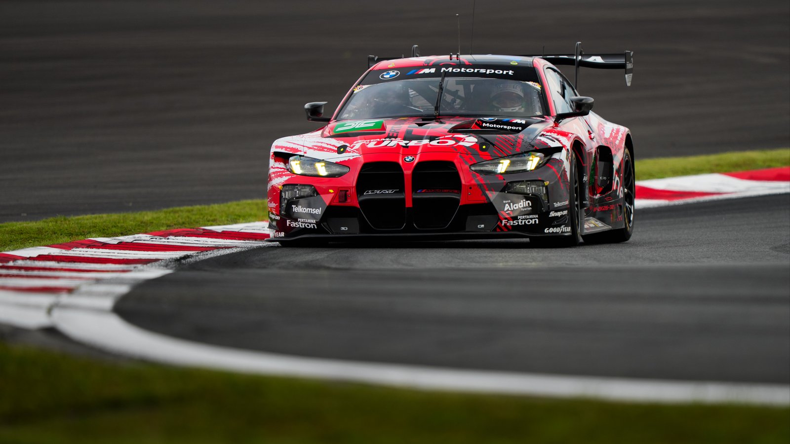 No. 20 Shell BMW M Hybrid V8 rounds a curb at Fuji Speedway