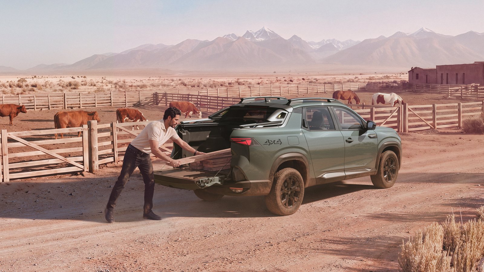 Man loading lumber into Renault Niagara bed at a ranch
