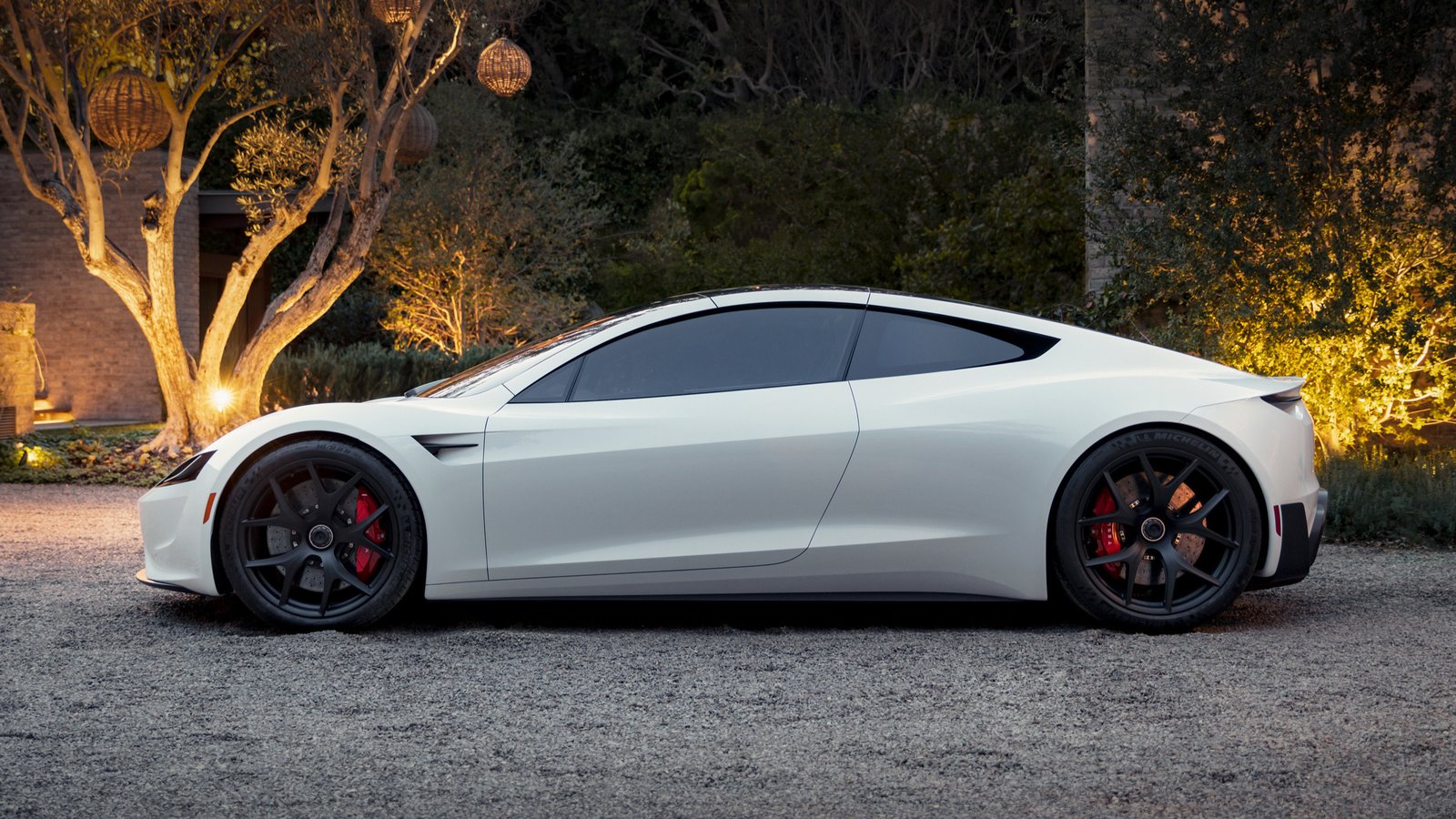 White 2017 Tesla Roadster prototype in side profile at dusk