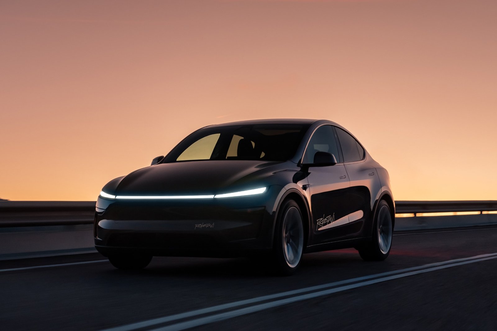 Tesla Model Y robotaxi with light bar driving at dusk