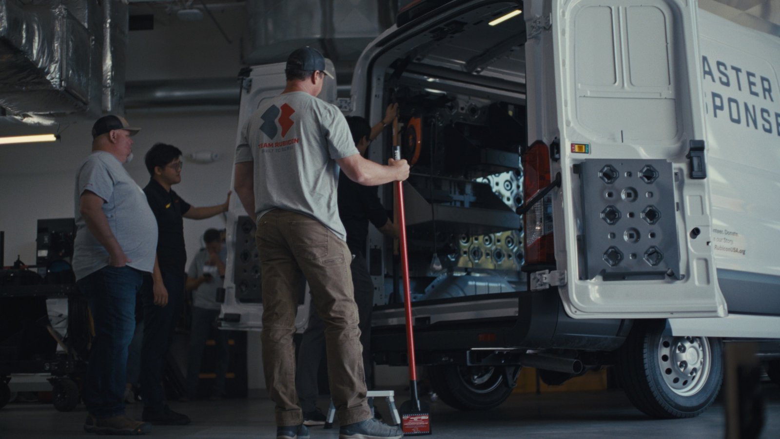 Ford and GRIDRACK team fitting the storage system into the Transit cargo bay