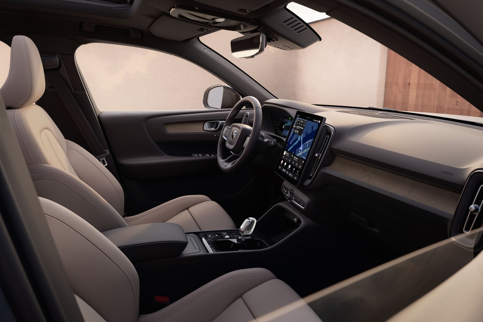 Refreshed Volvo XC40 front cabin with light leather seats and wood trim