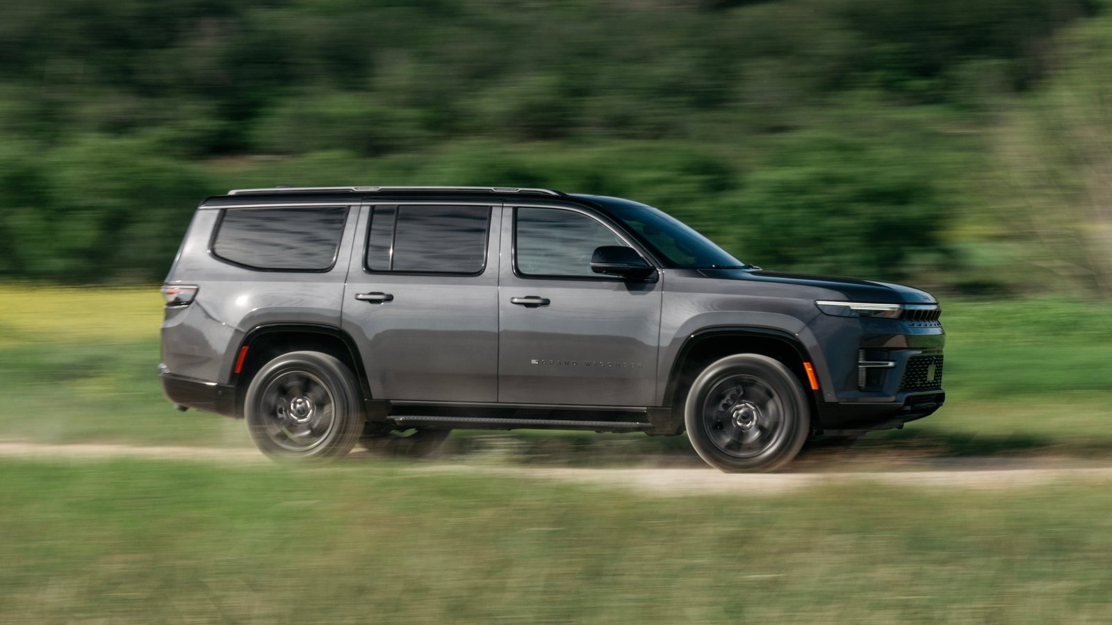 2026 Jeep Grand Wagoneer side profile showing full-length roof rails
