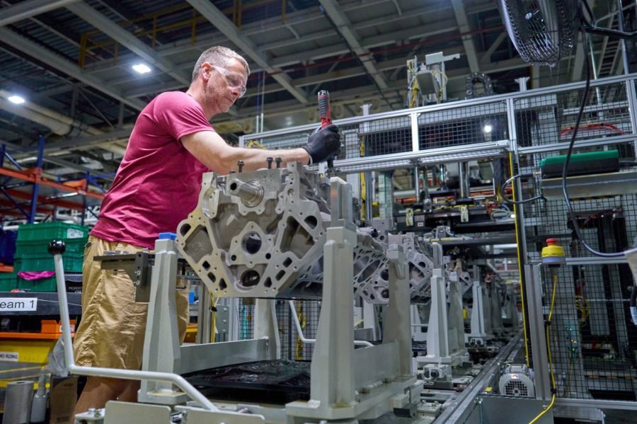 GM worker assembling a sixth-generation Small Block V8 engine block