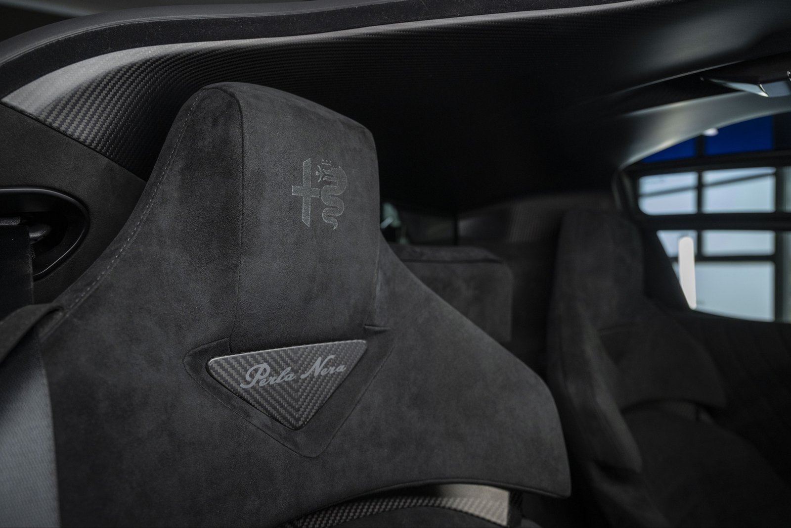 Alcantara sport seat headrest with Perla Nera carbon-fiber insert in the Alfa Romeo 33 Stradale