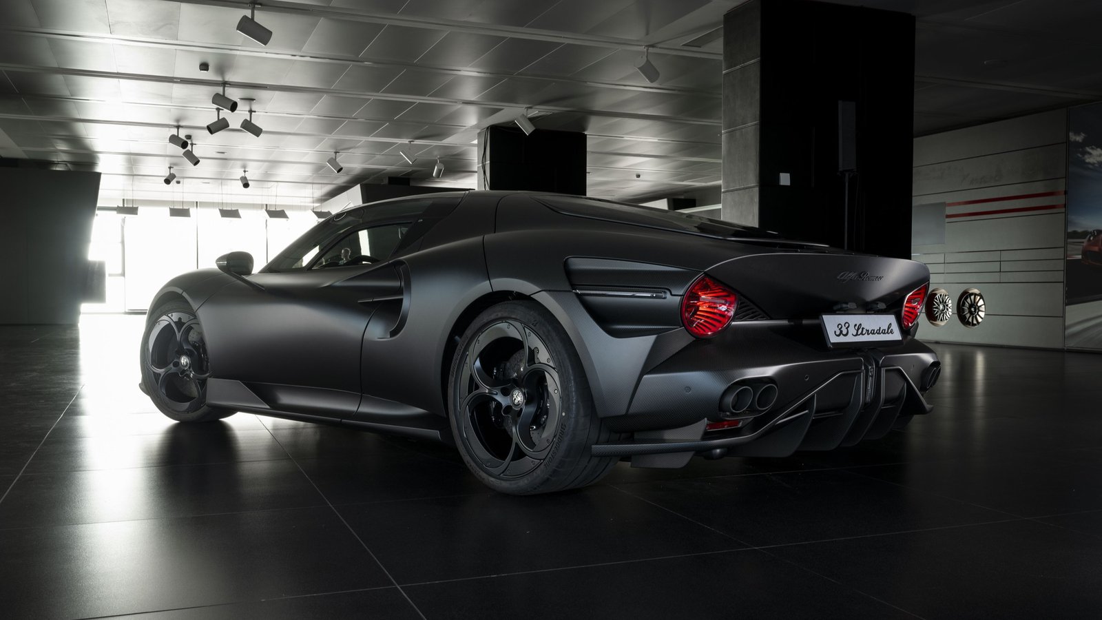 Rear three-quarter view of the Alfa Romeo 33 Stradale Perla Nera with all-black wheels