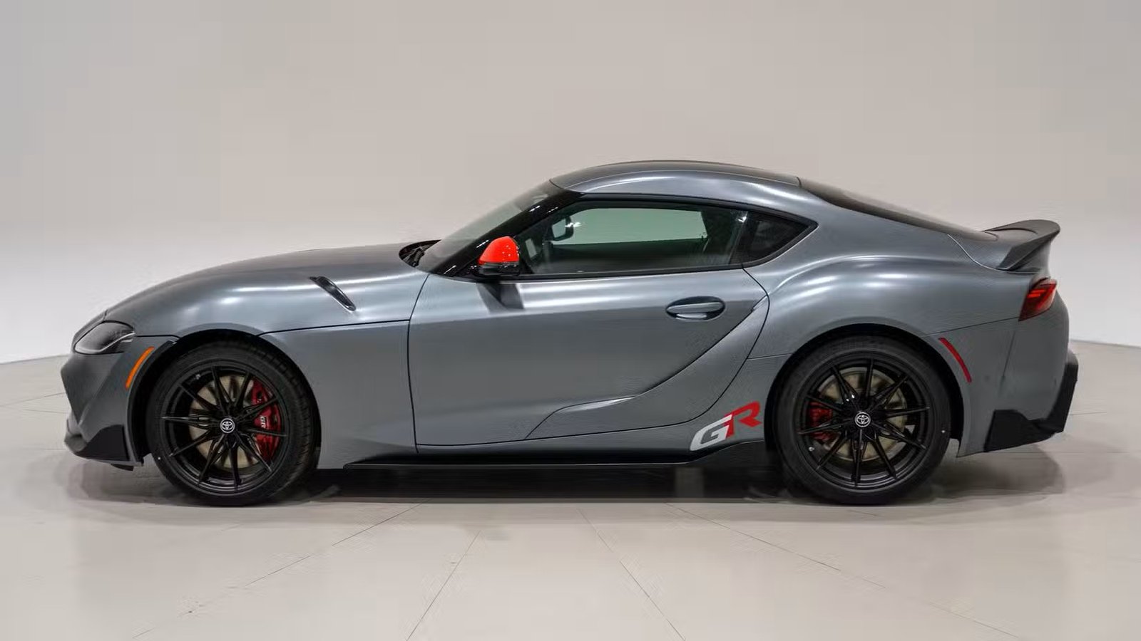 Side profile of the final Toyota GR Supra with carbon ducktail spoiler