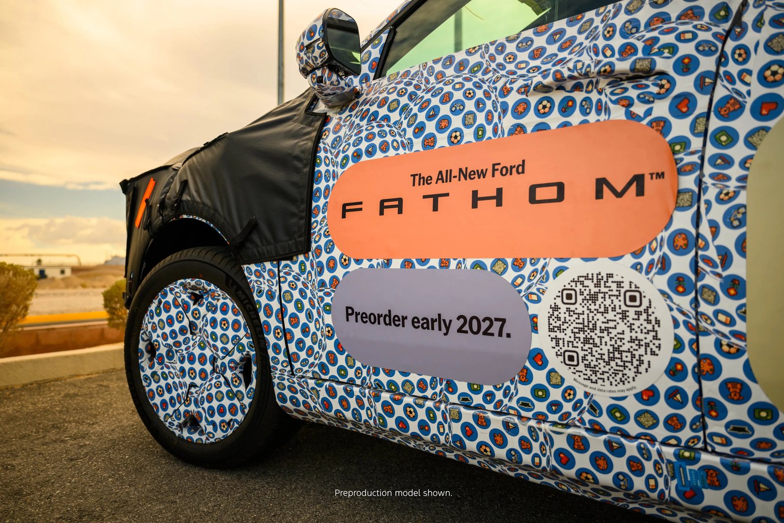 Preorder early 2027 decals on a camouflaged Ford Fathom prototype door