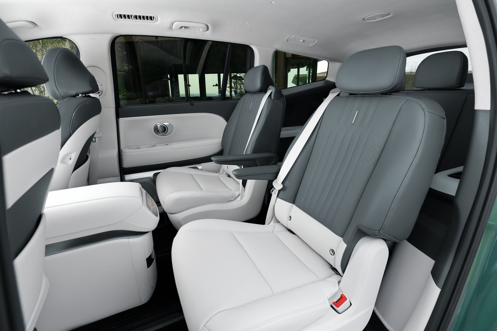 Hyundai Ioniq 9 second-row power captain's chairs seen through the open rear door