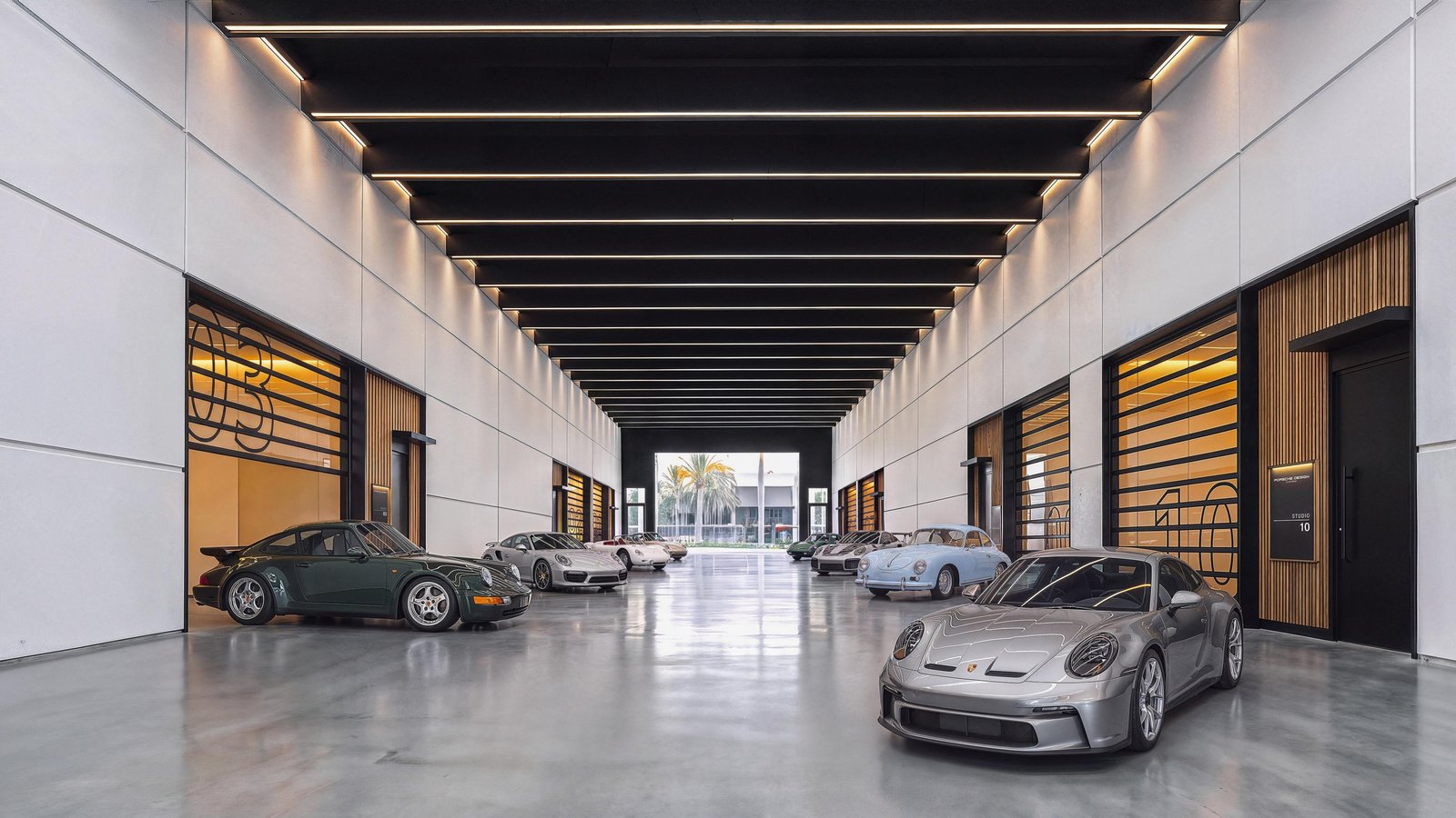Rendering of The Concours indoor promenade lined with private car studios