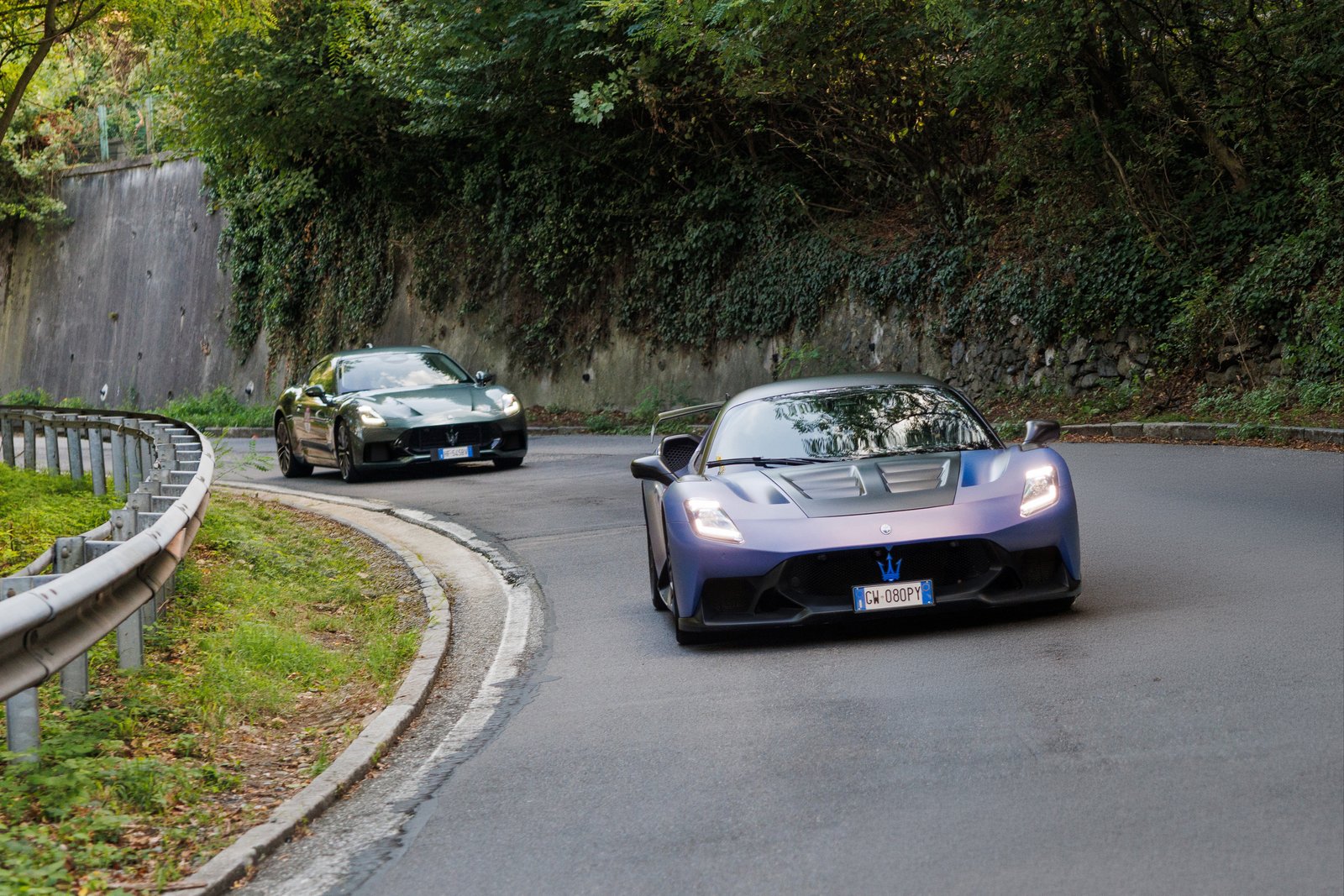 Maserati GT2 Stradale and GranTurismo driving a hillside road near Turin
