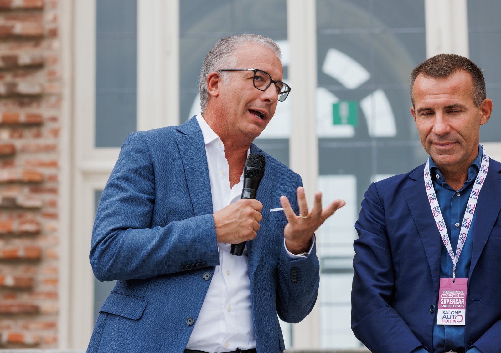 Santo Ficili and Andrea Levy speaking at the Supercar Meeting in Turin