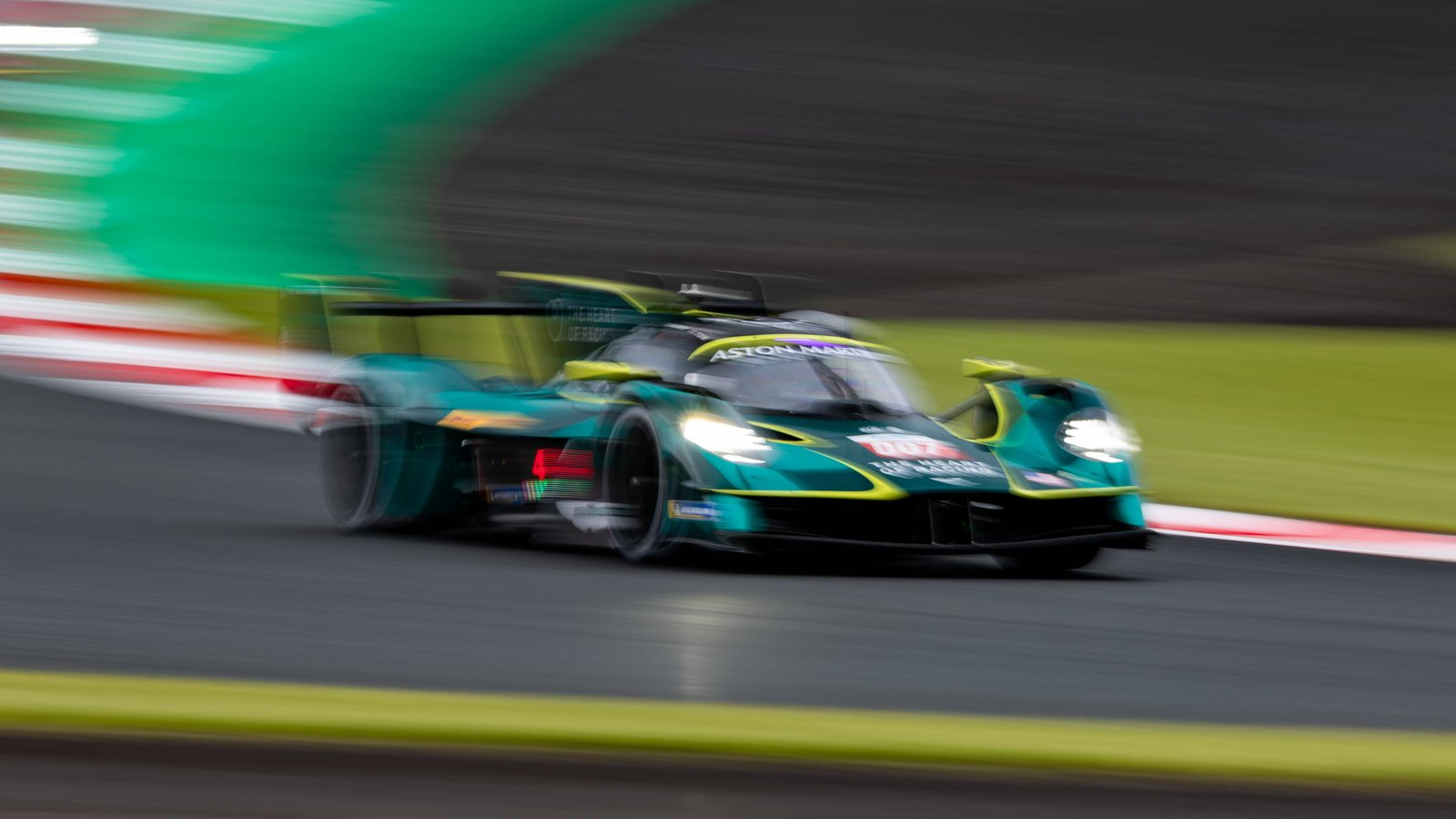 The #007 Aston Martin Valkyrie Hypercar at speed with motion-blurred background