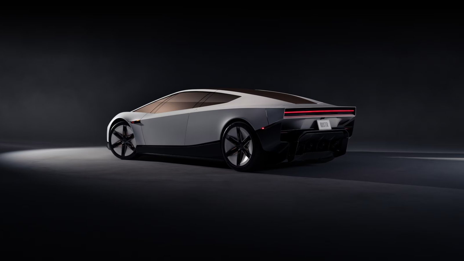 Tesla Roadster rear three-quarter studio view with full-width taillight