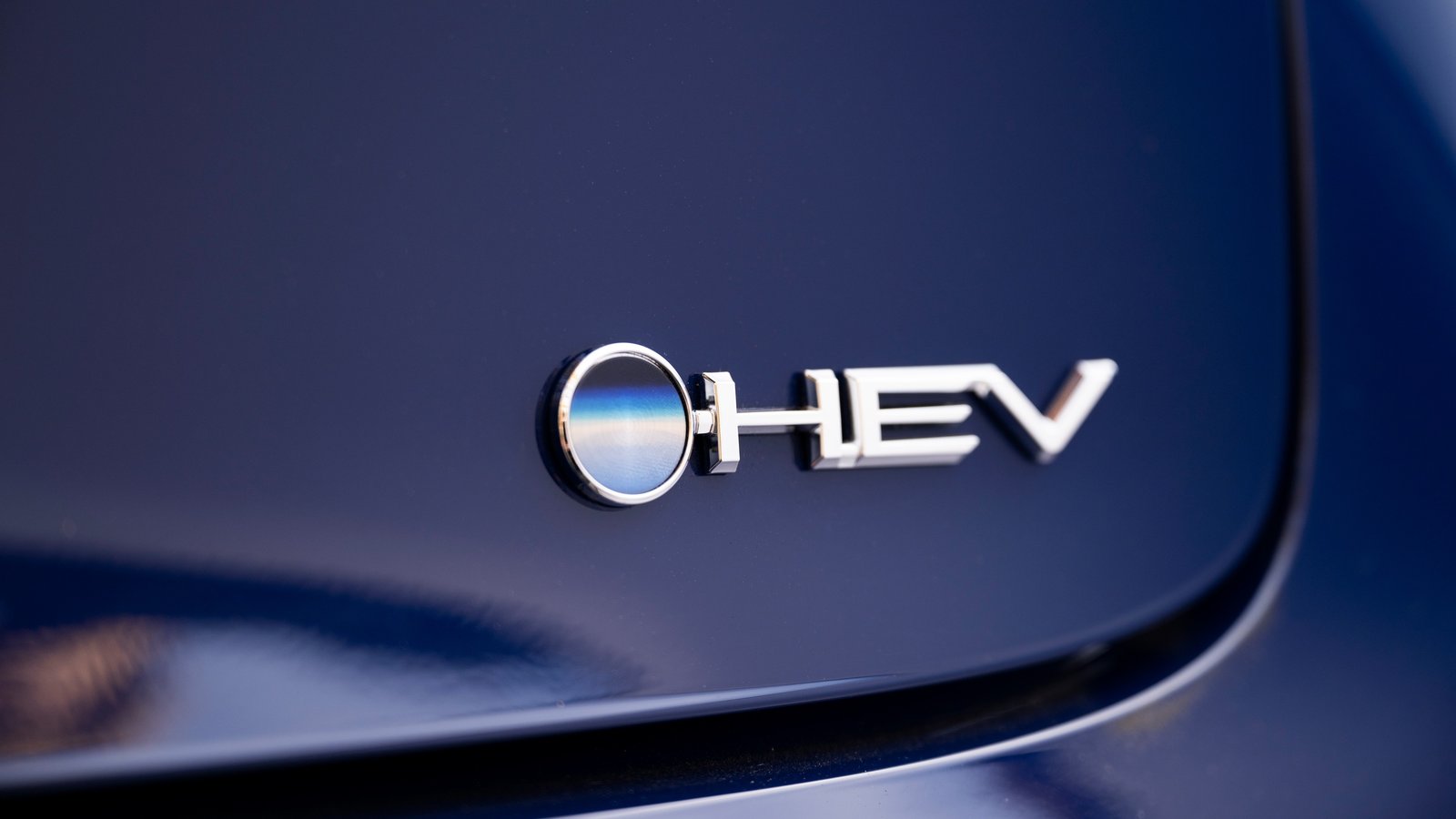 HEV badge on the tailgate of a blue 2026 Toyota Prius