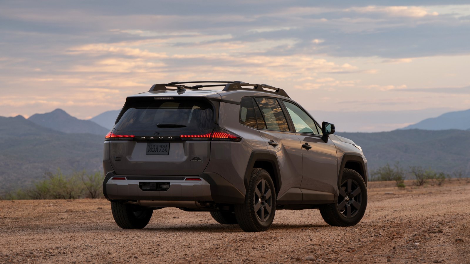 2026 Toyota RAV4 Woodland seen from the rear on a desert road