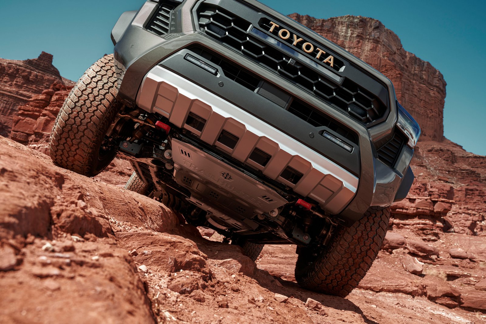 2026 Toyota Tacoma Trailhunter climbing over red rocks