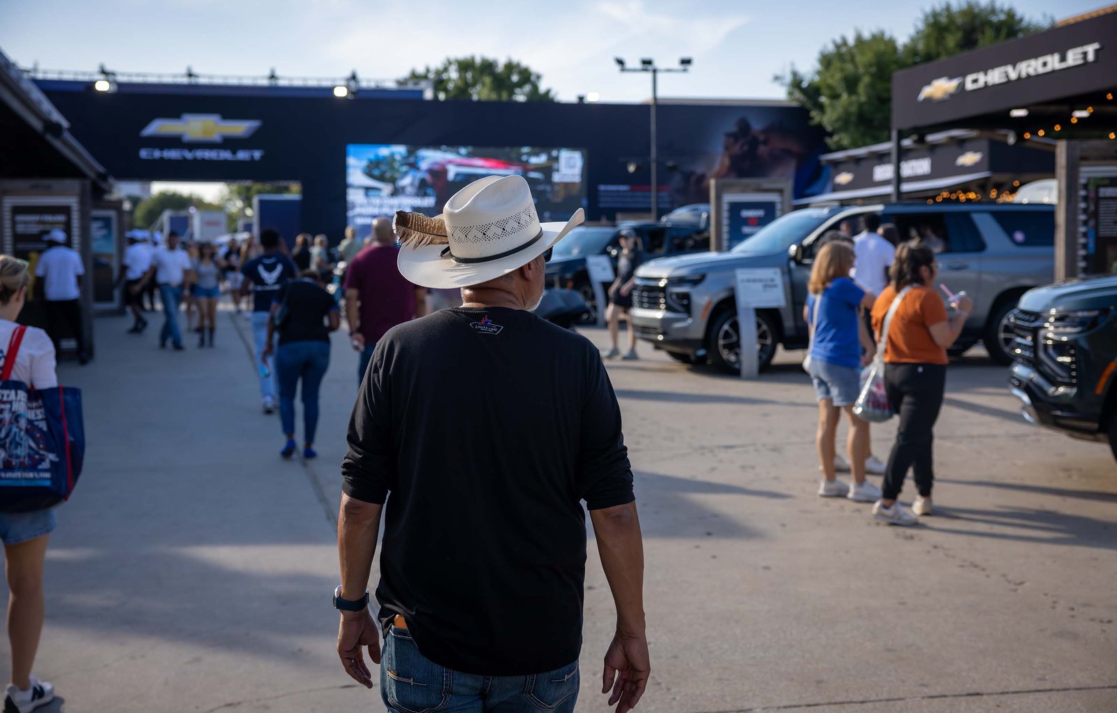 Visitors walk through the Chevrolet display at the State Fair of Texas