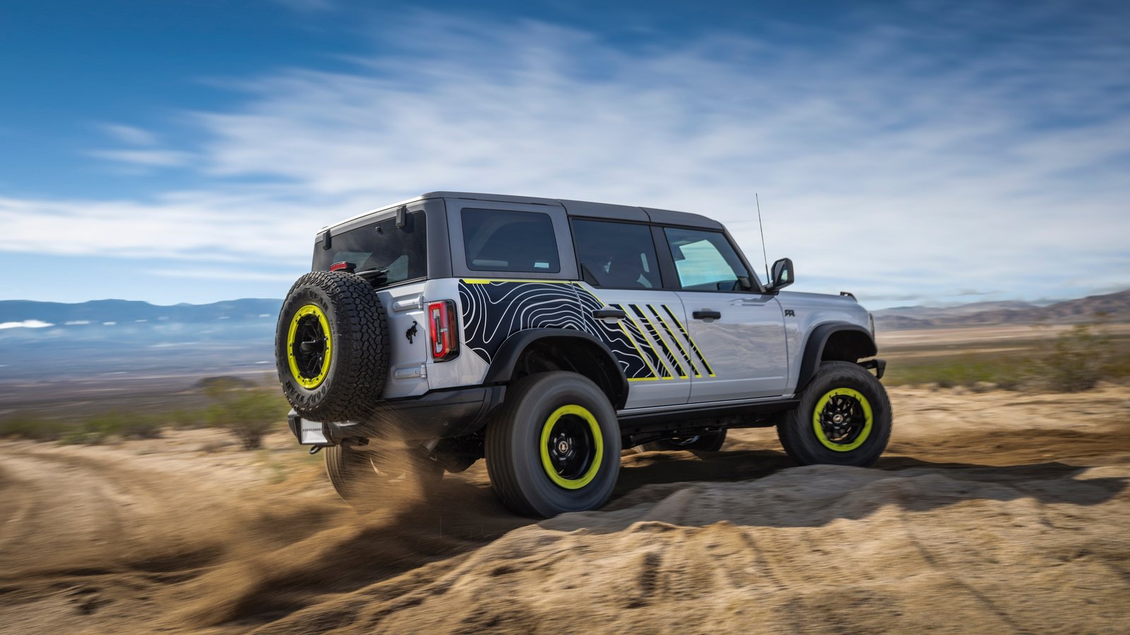 Bronco RTR with topographic side graphics driving through sand