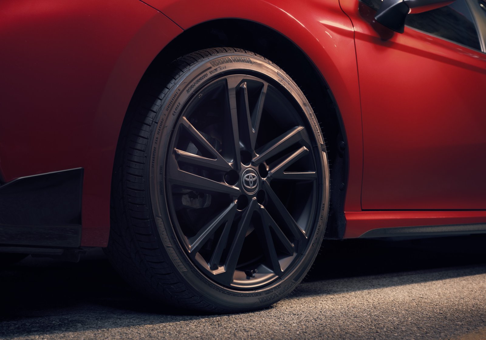 Close-up of 2027 Toyota Camry Nightshade black 19-inch alloy wheel