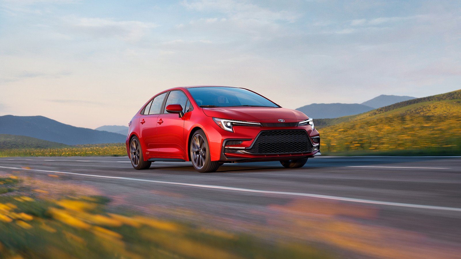 2027 Toyota Corolla sedan driving on a mountain road