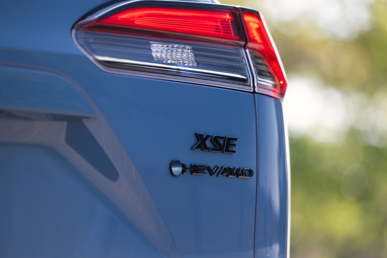 Corolla Cross Hybrid XSE and HEV AWD badges on tailgate