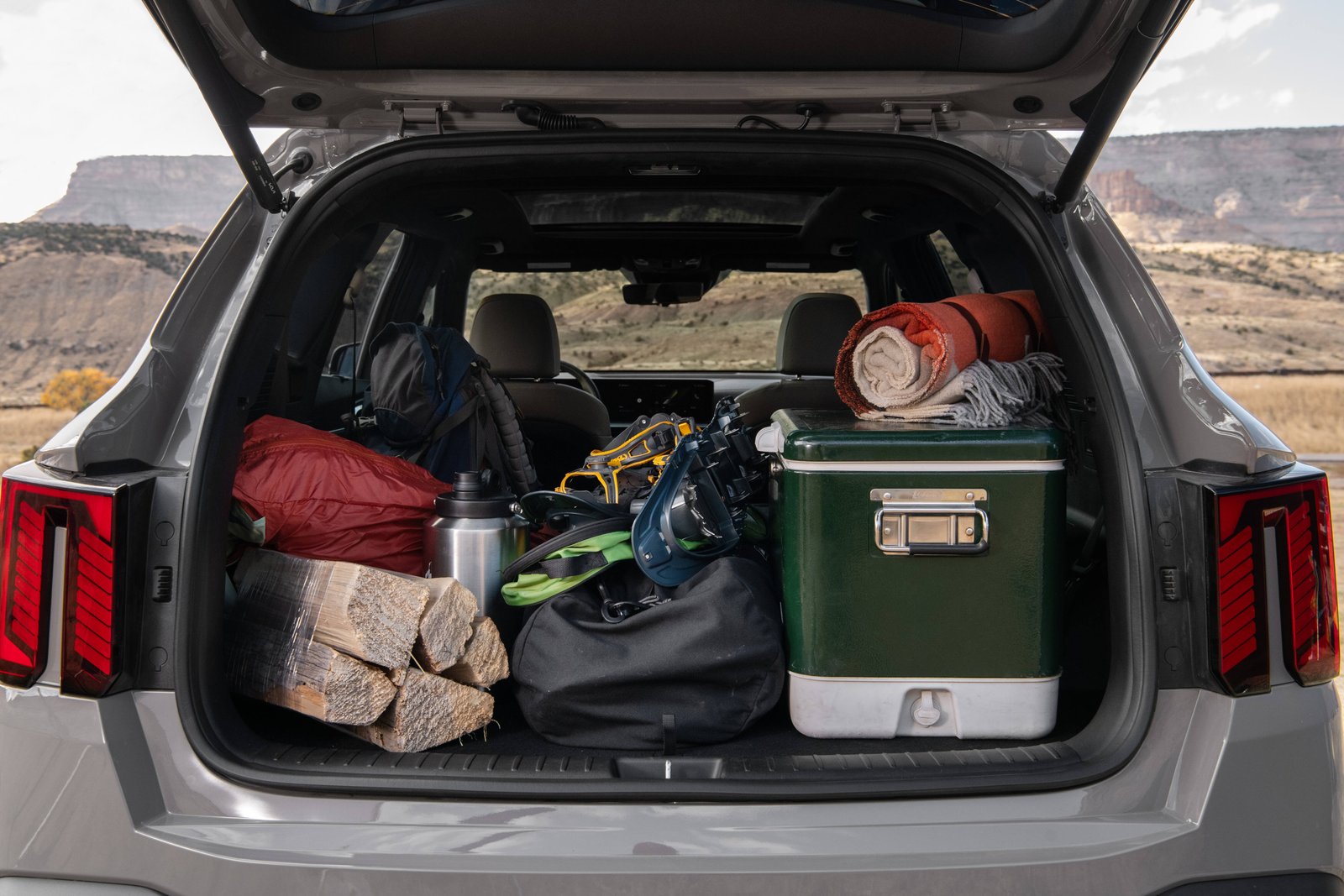 Cargo area of the 2027 Kia Sorento Hybrid loaded with camping gear