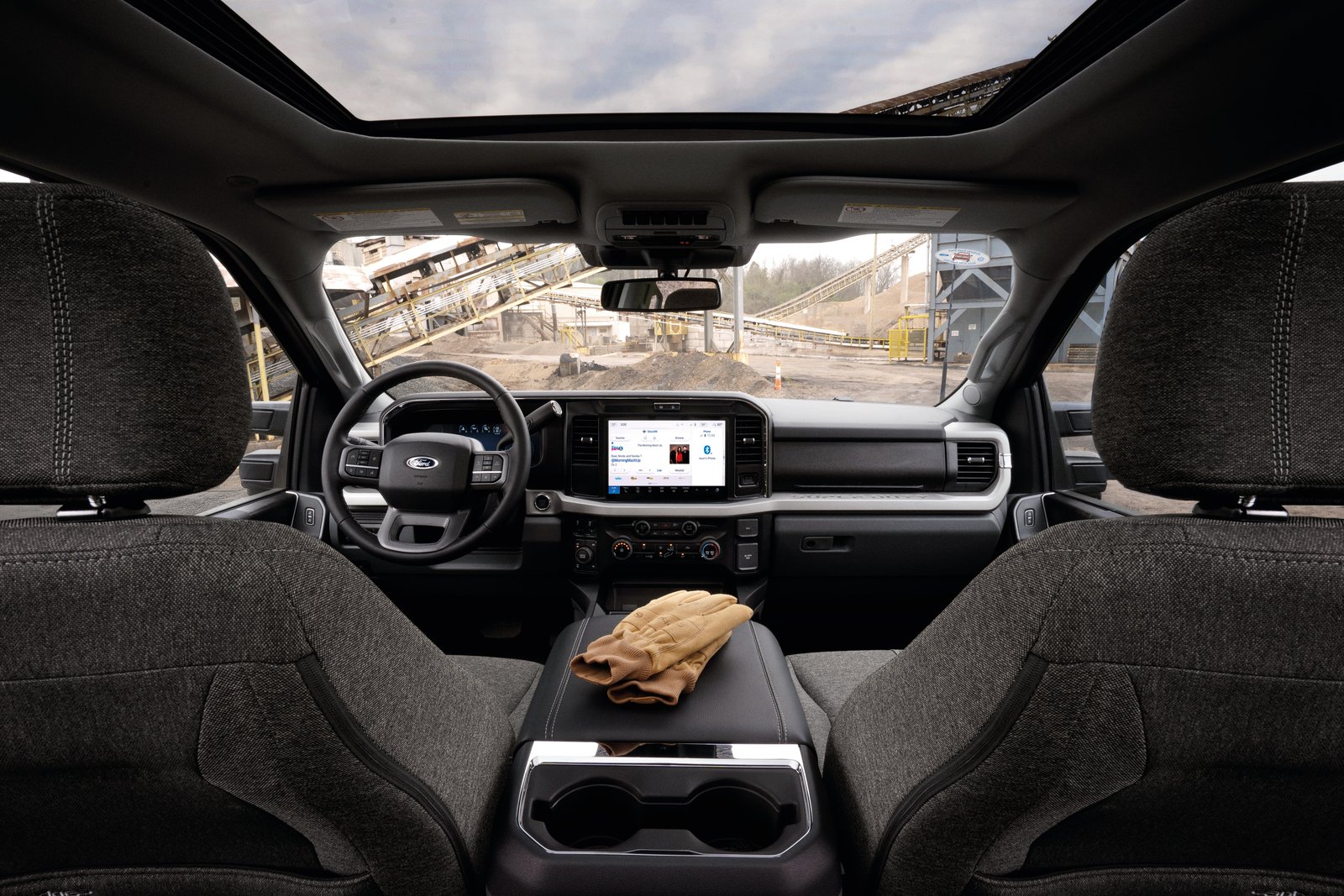Gray cloth interior of the 2027 Ford Super Duty Carhartt at a quarry