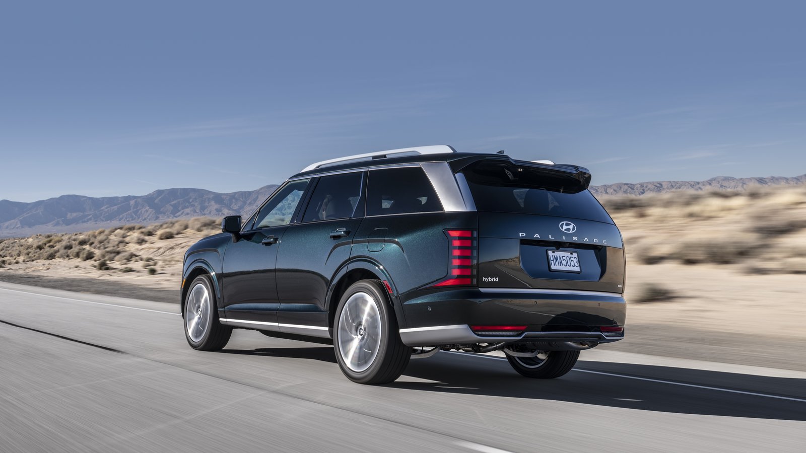 2026 Hyundai Palisade Hybrid rear three-quarter view driving