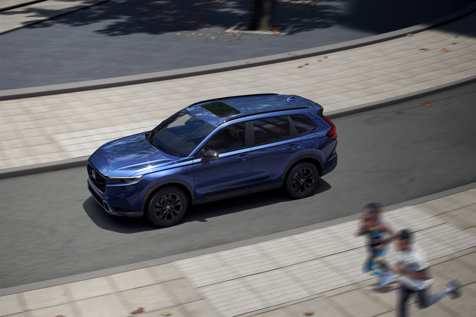 2026 Honda CR-V Hybrid overhead view driving on city street