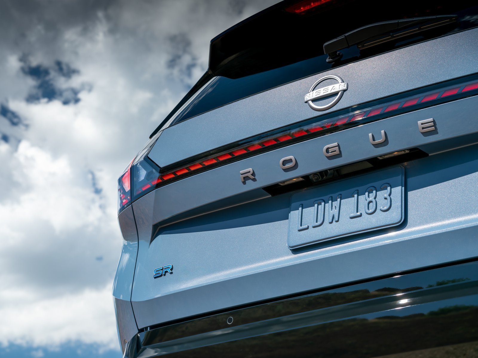 Close-up of Rogue lettering and SR badge on the 2027 Nissan Rogue Hybrid tailgate