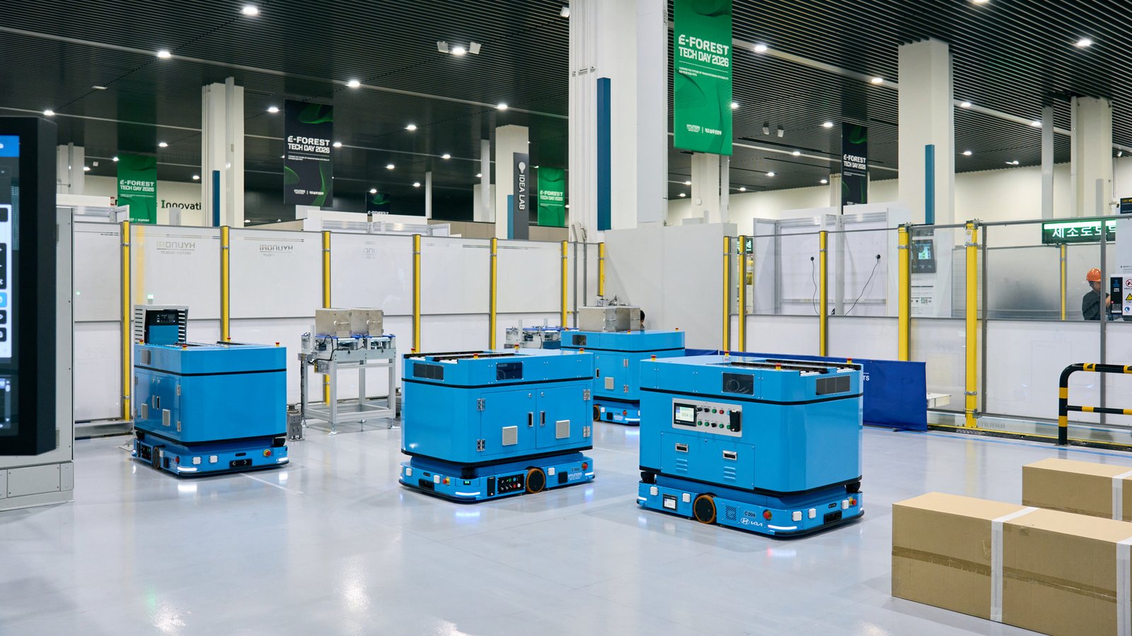 Blue autonomous mobile robots on the E-FOREST TECH DAY 2026 show floor