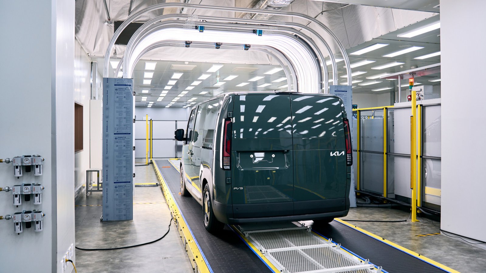 Kia PV5 van inside a tunnel-type 3D exterior inspection system