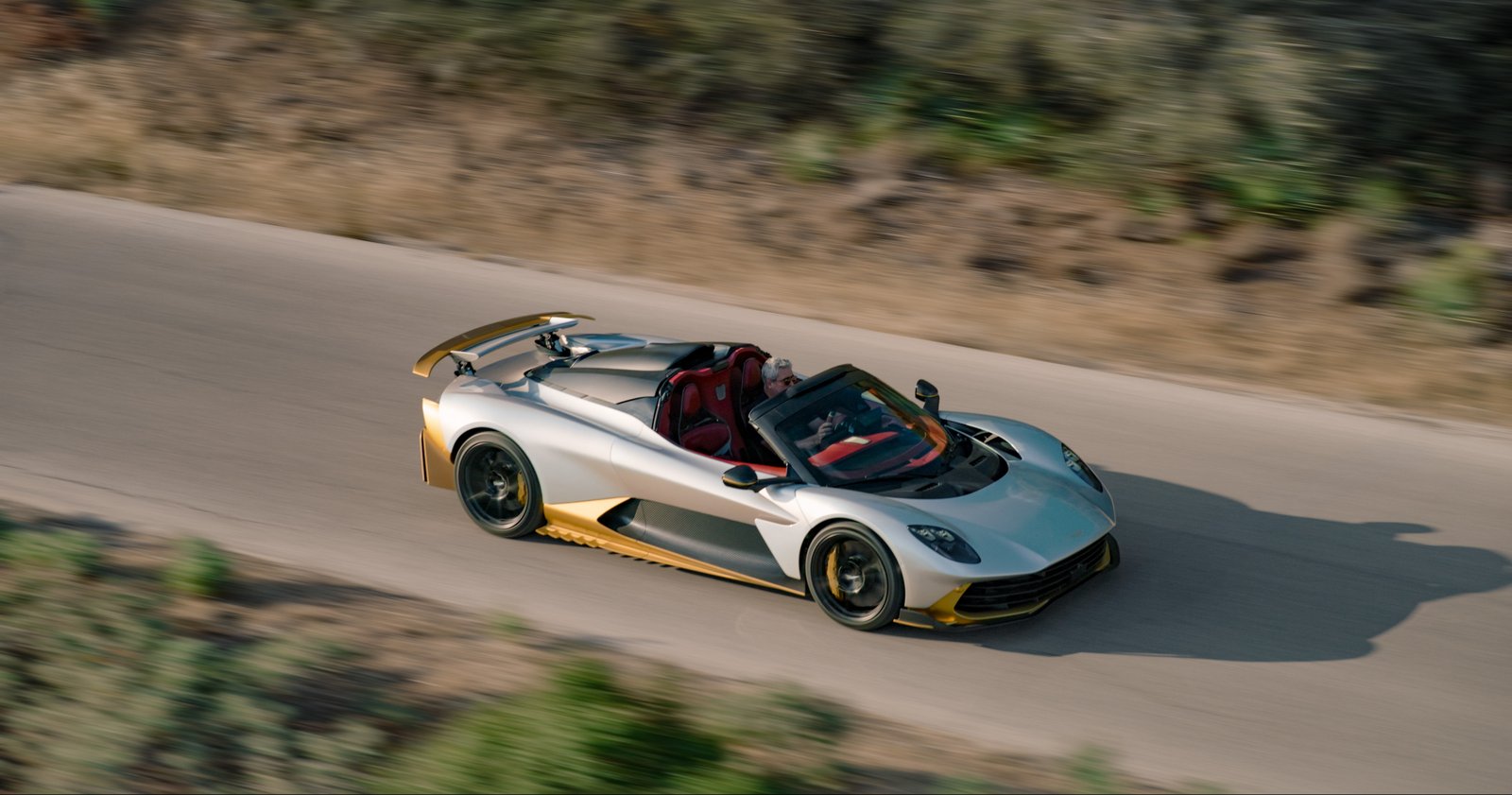 Overhead view of the Valhalla Spider's open cockpit on a canyon road