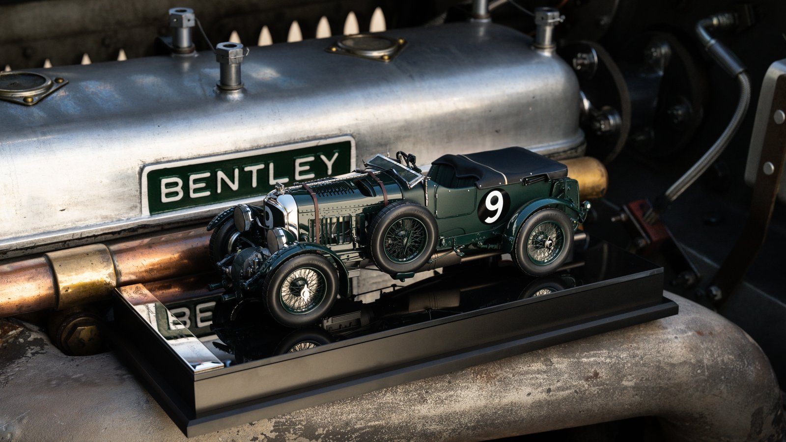 Amalgam 1:18 Bentley Blower model resting on the original car’s engine