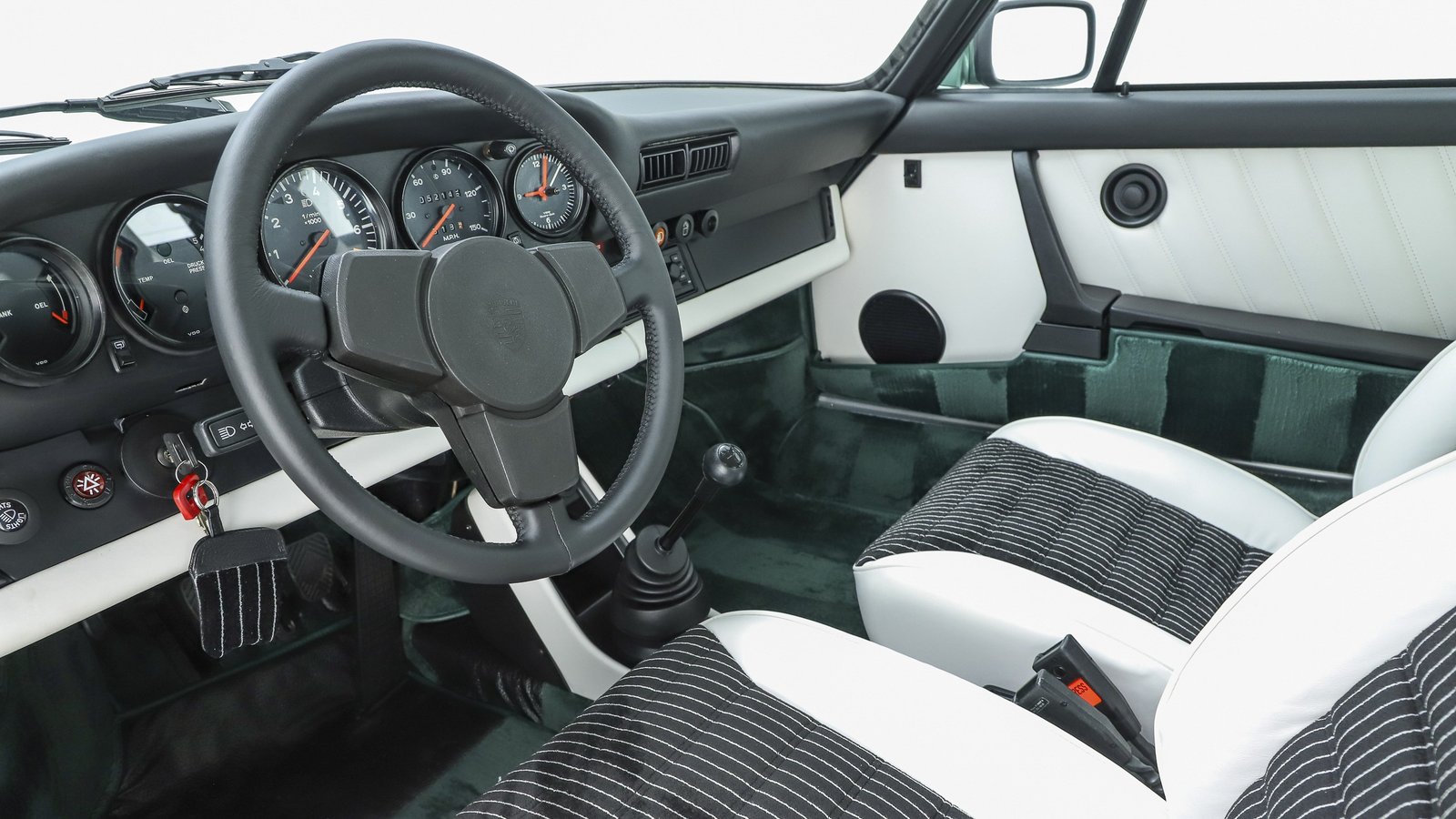 White leather and pinstripe velour interior of a 1978 Porsche 930 Turbo