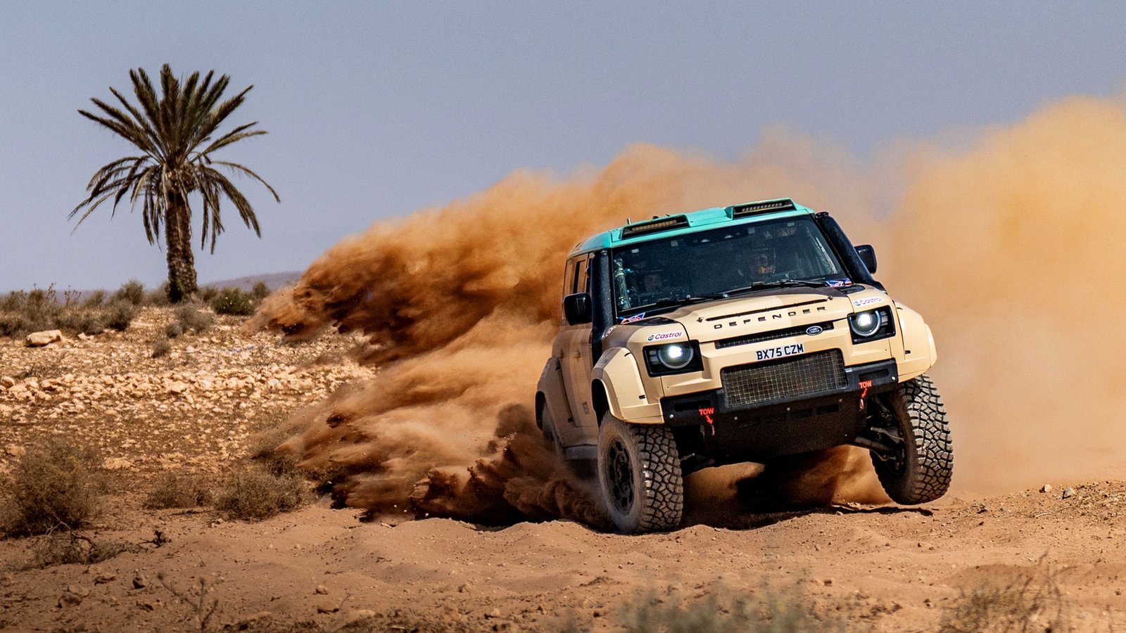 Stéphane Peterhansel's Defender D7X-R sliding on a Moroccan dirt track