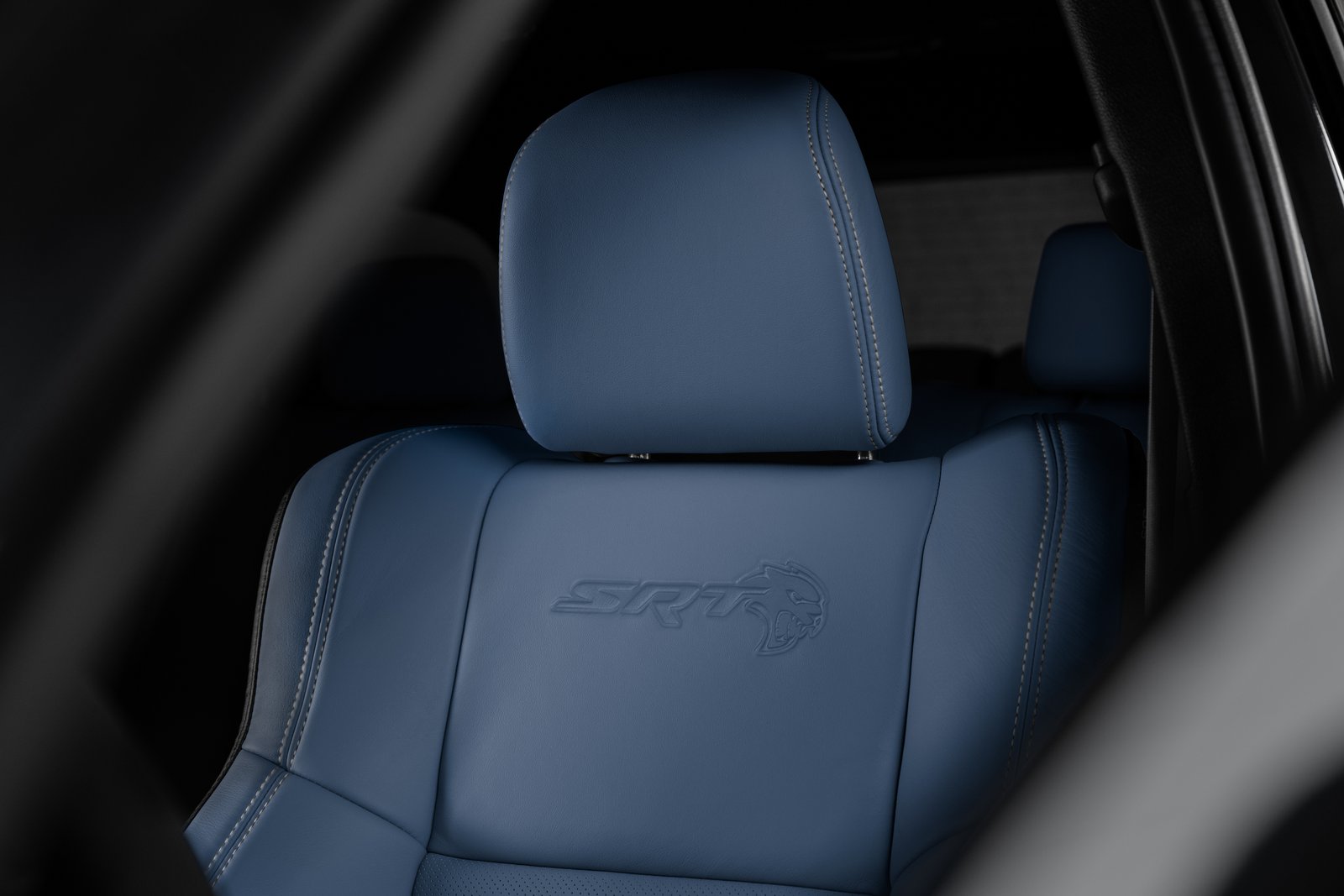 Embossed SRT Hellcat logo on Petrol Blue leather seatback
