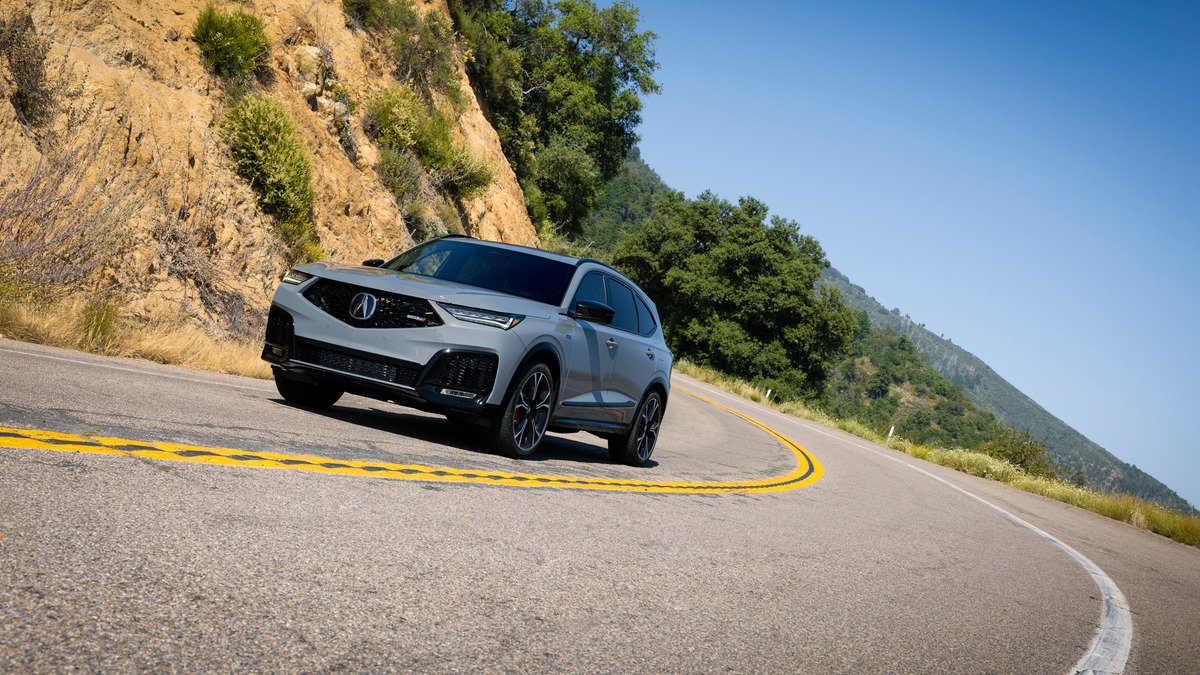 2026 Acura MDX Type S front three-quarter view on a mountain road