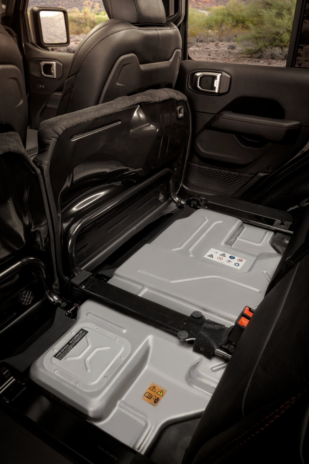 Jeep Wrangler 4xe high-voltage battery pack beneath the folded rear sea