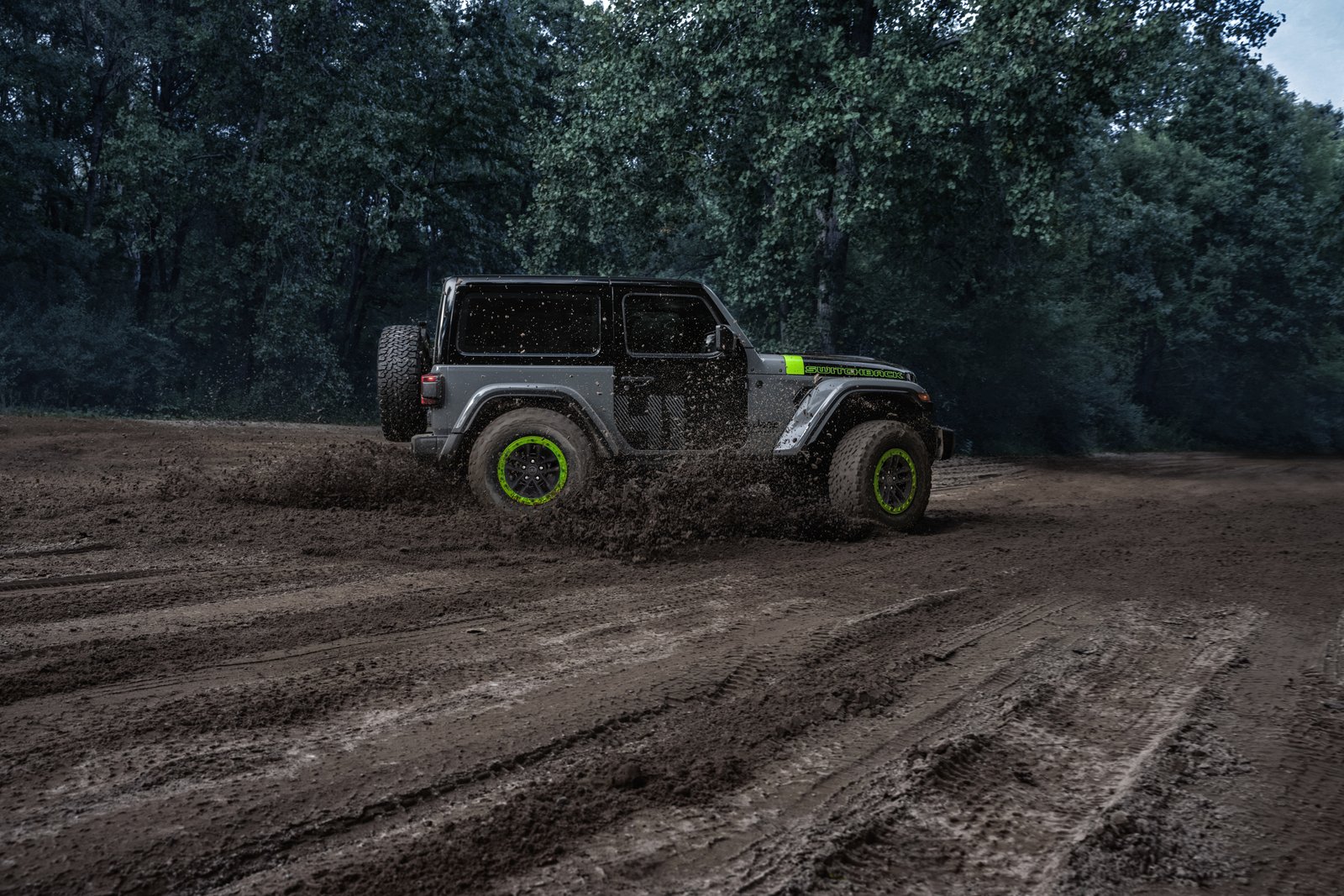 Two-door Jeep Wrangler Switchback in gray with black doors